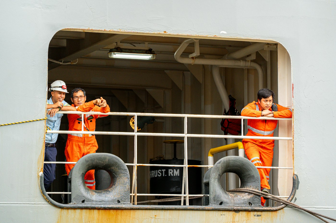 Crew members talking at a window