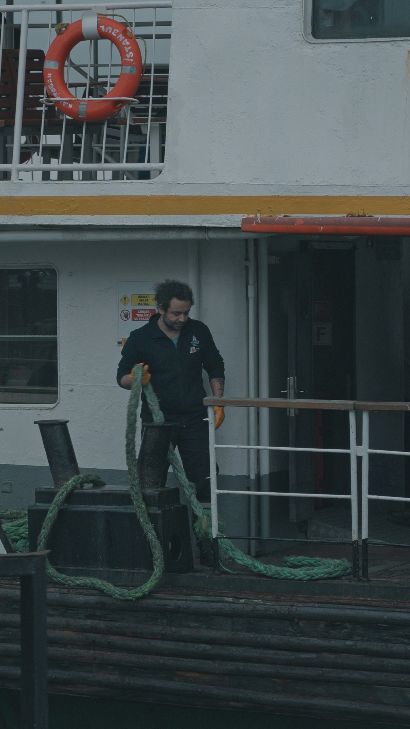 Seafarer handling a mooring rope